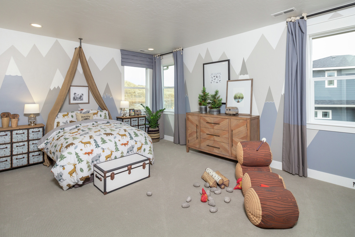 kids bedroom featuring dressers and storage chest